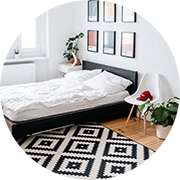 Bedroom with bed, carpet and chair