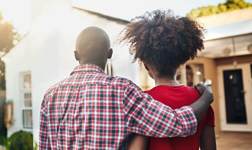 A Couple looks at their home