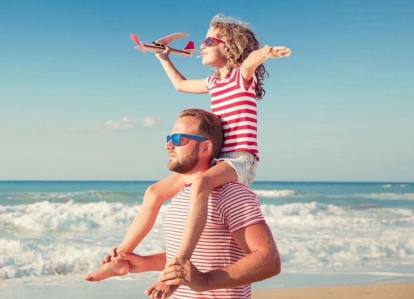 Father and daughter on a beach