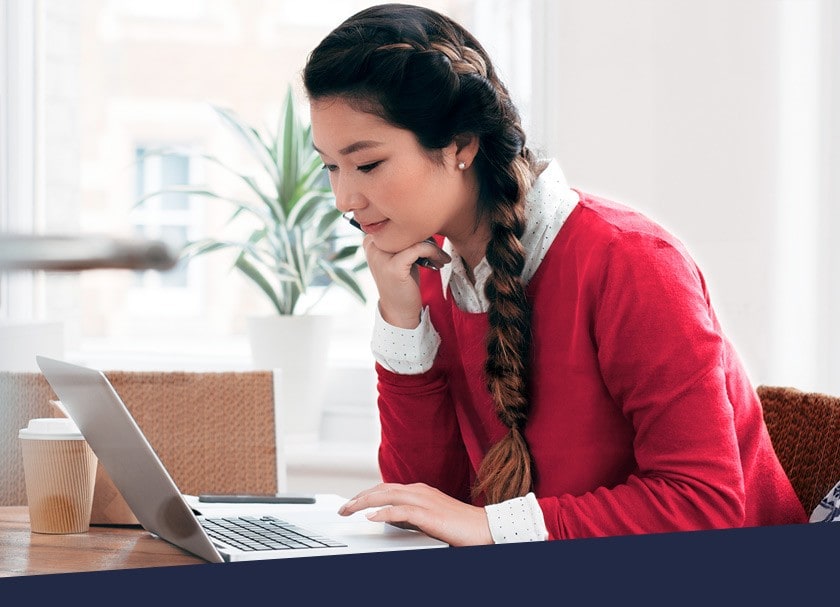 Student applies for Simplii's International GIC program on a laptop