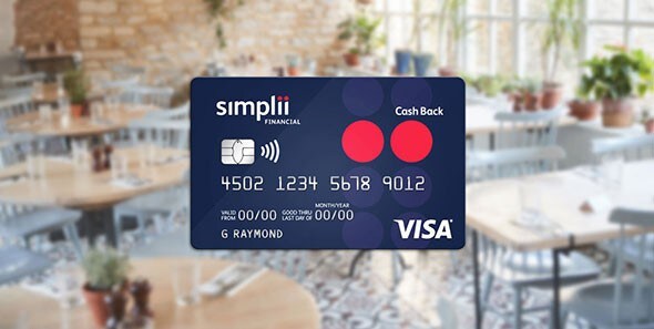 A Simplii Financial Cash Back Visa Card with a restaurant in the background