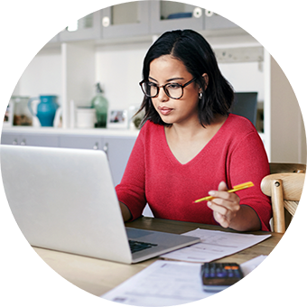 Woman calculates her finances on her computer